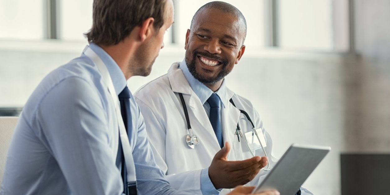 Multiethnic specialist doctors discussing case