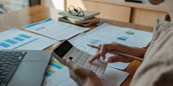 business-woman-using-calculator-for-analysis-maket-2022-08-18-23-30-19-utc