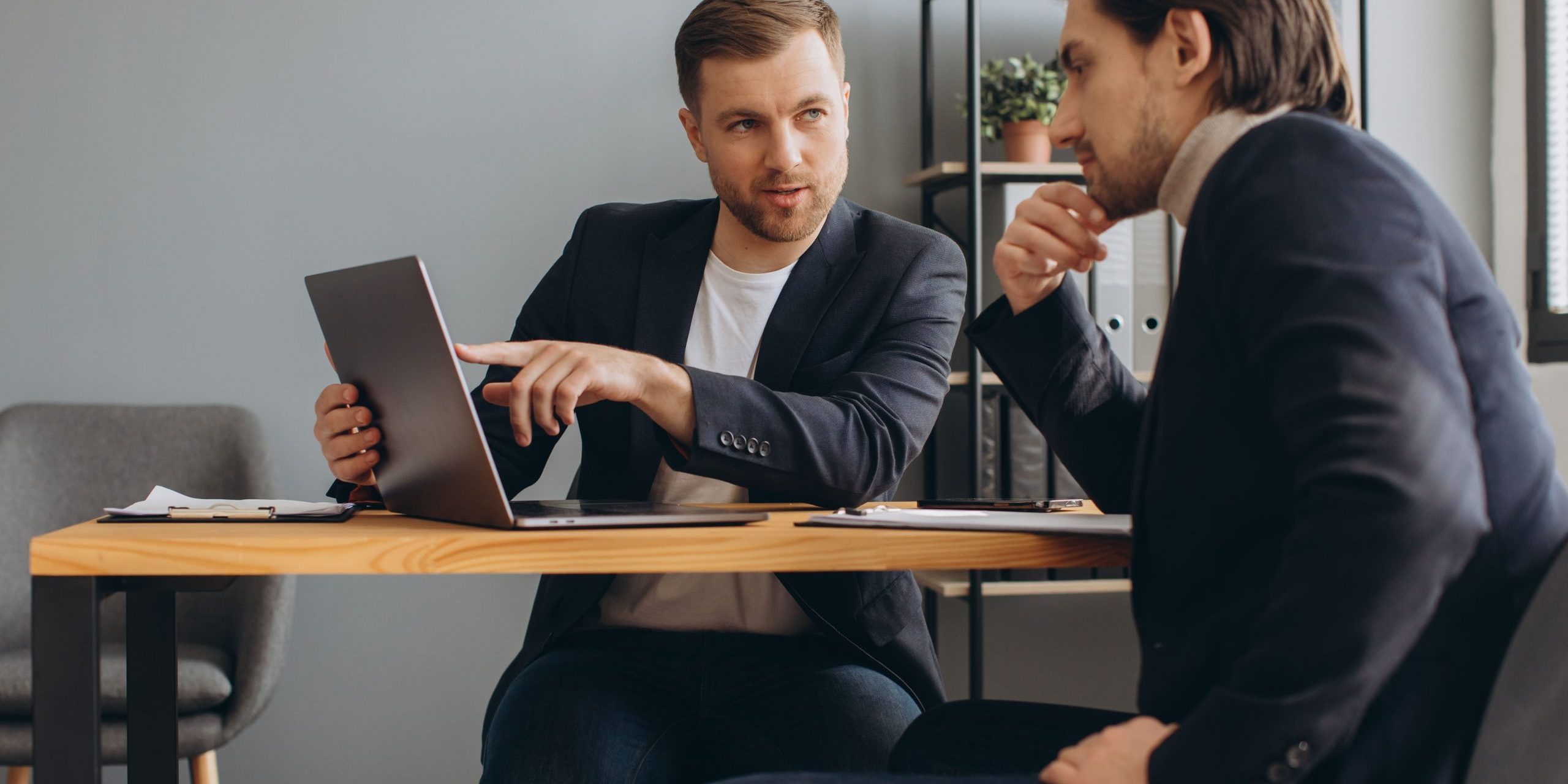 two-successful-male-partners-negotiation-project-i-2023-11-27-05-35-56-utc