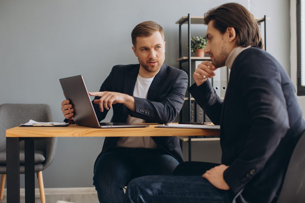 two-successful-male-partners-negotiation-project-i-2023-11-27-05-35-56-utc